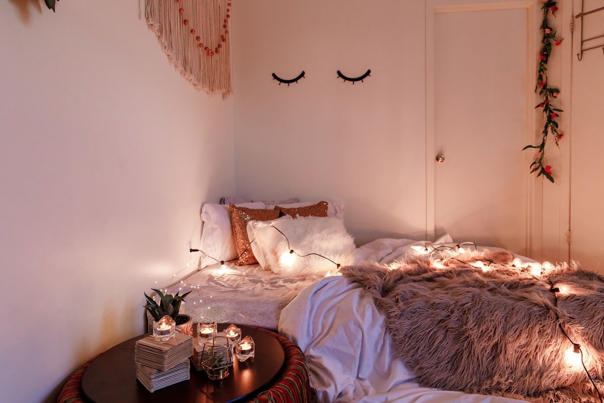 Simple white nightstand styling in a small bedroom