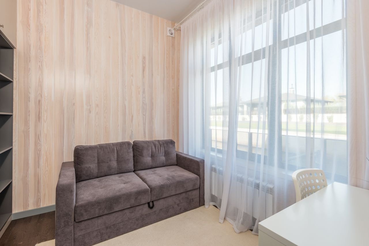 Bright small apartment living room with modern sofa on a budget