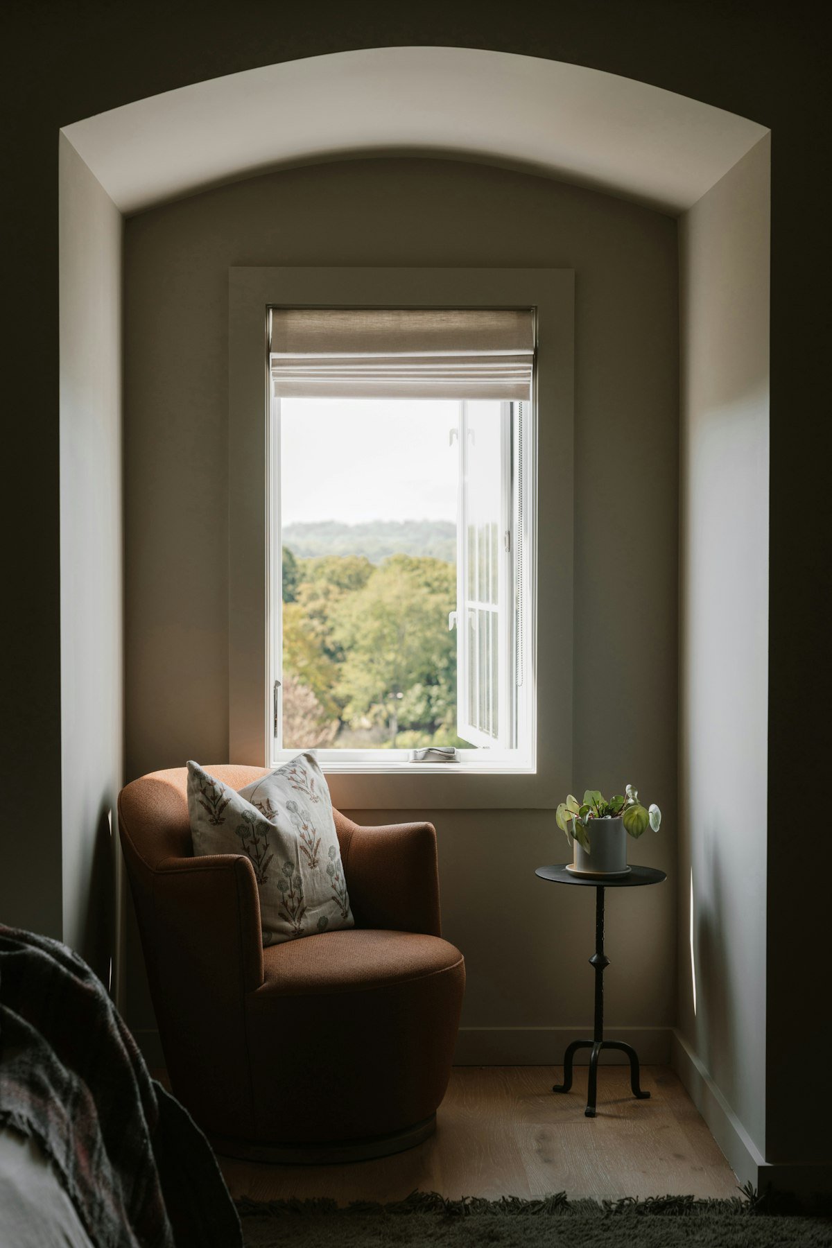 Cozy armchair reading corner beside a window