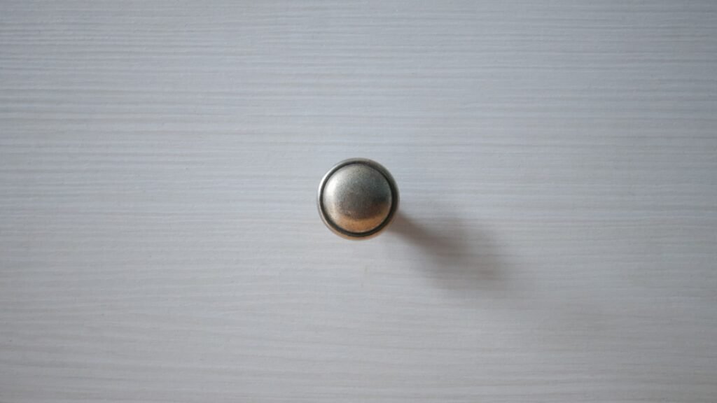 Thrifted wood dresser updated with modern brass knob hardware