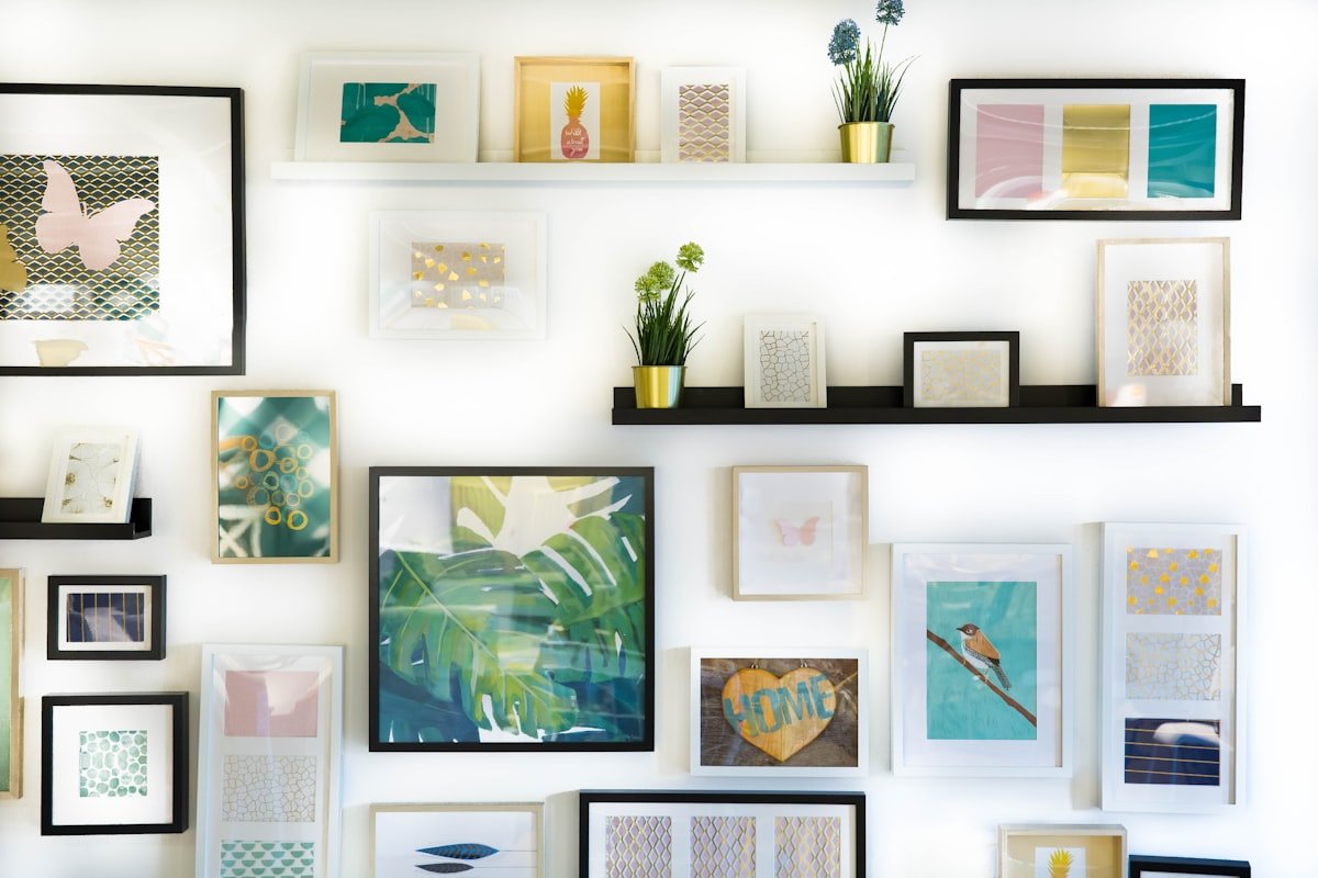 Colorful framed art gallery wall in an apartment living space