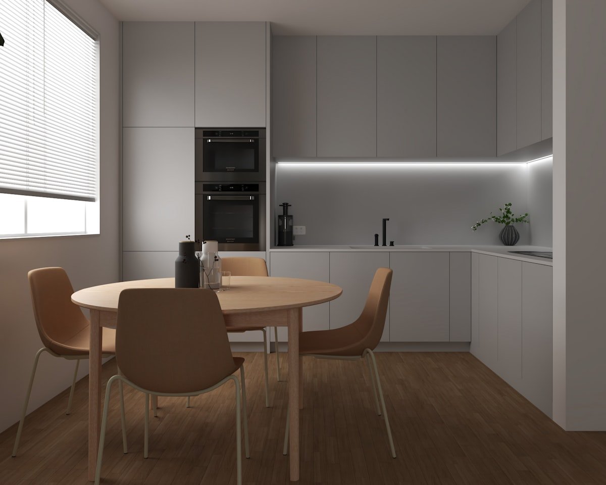 Compact kitchen dining nook beside a bright window