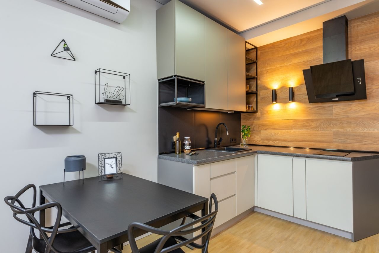 Small kitchen dining nook with decorated wall in a rental