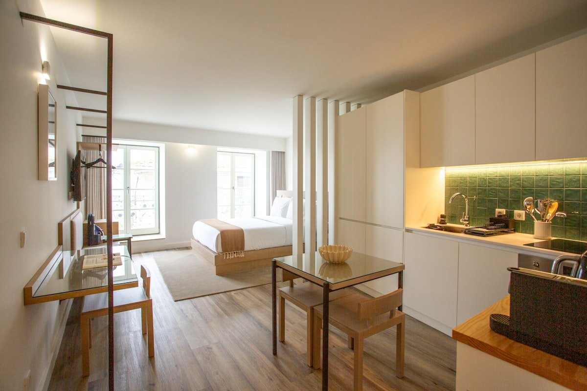 Studio apartment kitchen and dining zone with small table