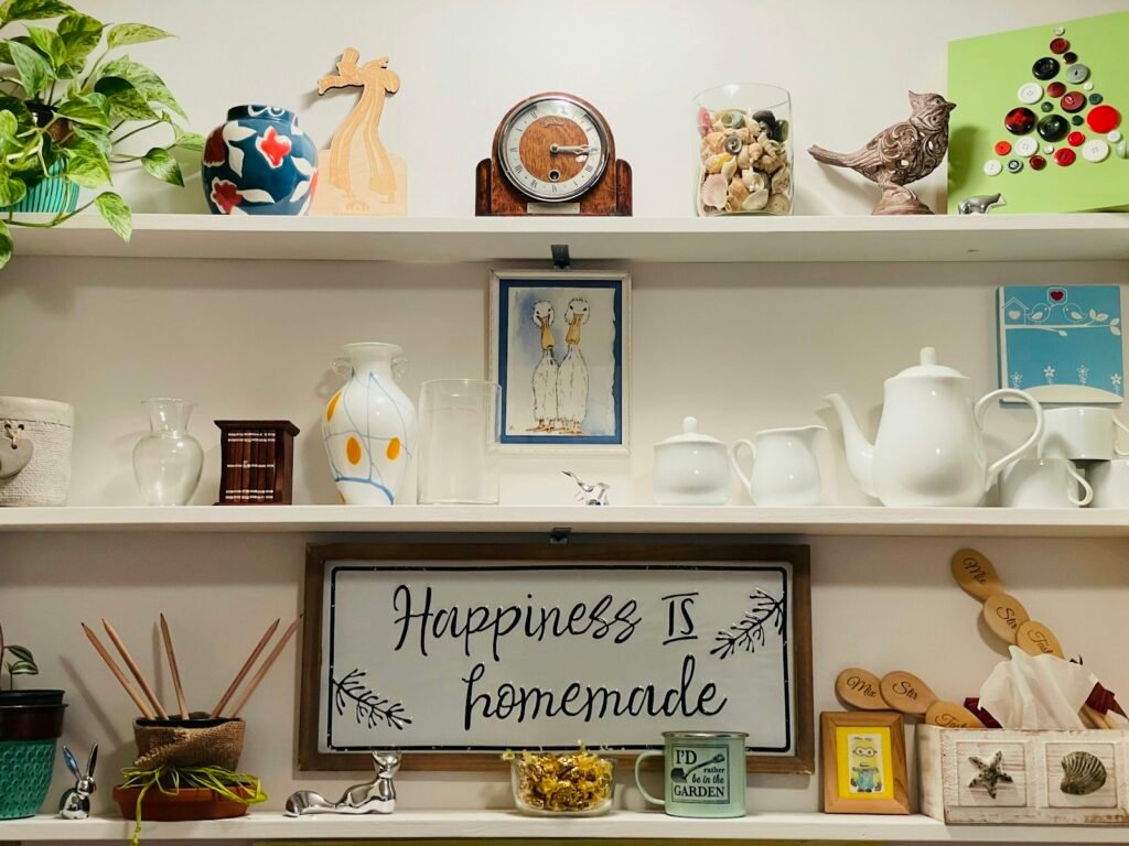 Thrift store shelves filled with vases lamps and secondhand home decor