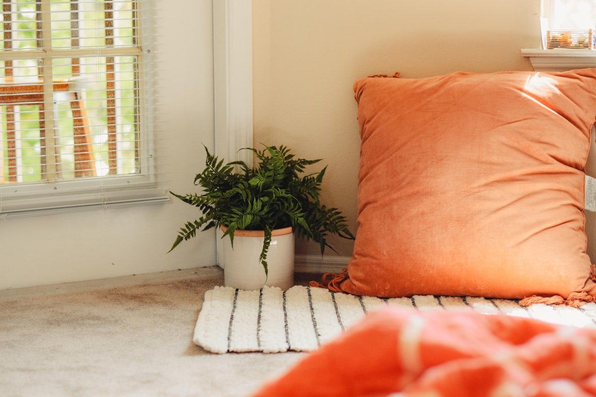 Warm textured throw pillow — small touches make a rental feel like home
