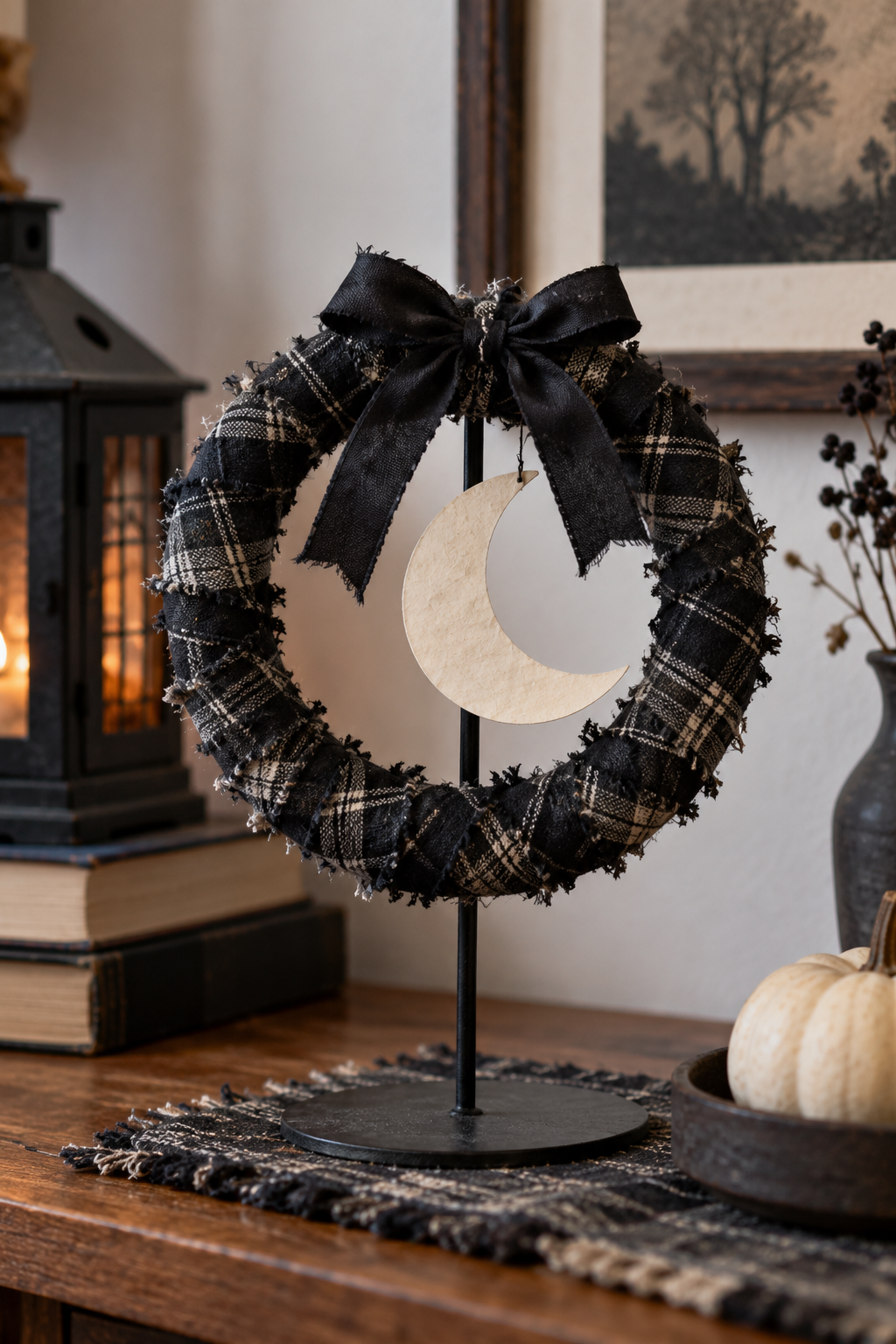 Small fabric wrapped Halloween wreath on a stand