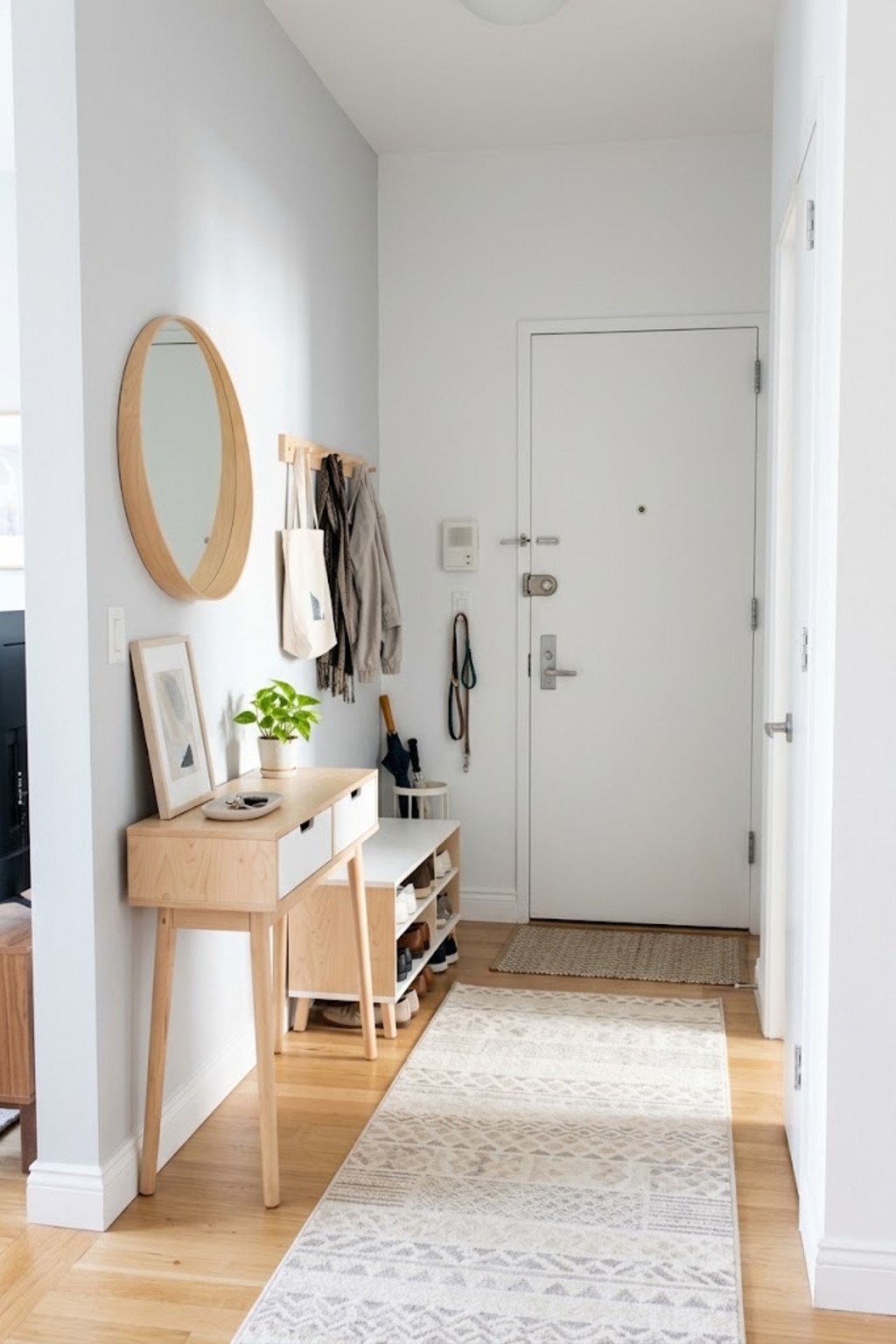 Brighten with light colors in a small apartment entryway