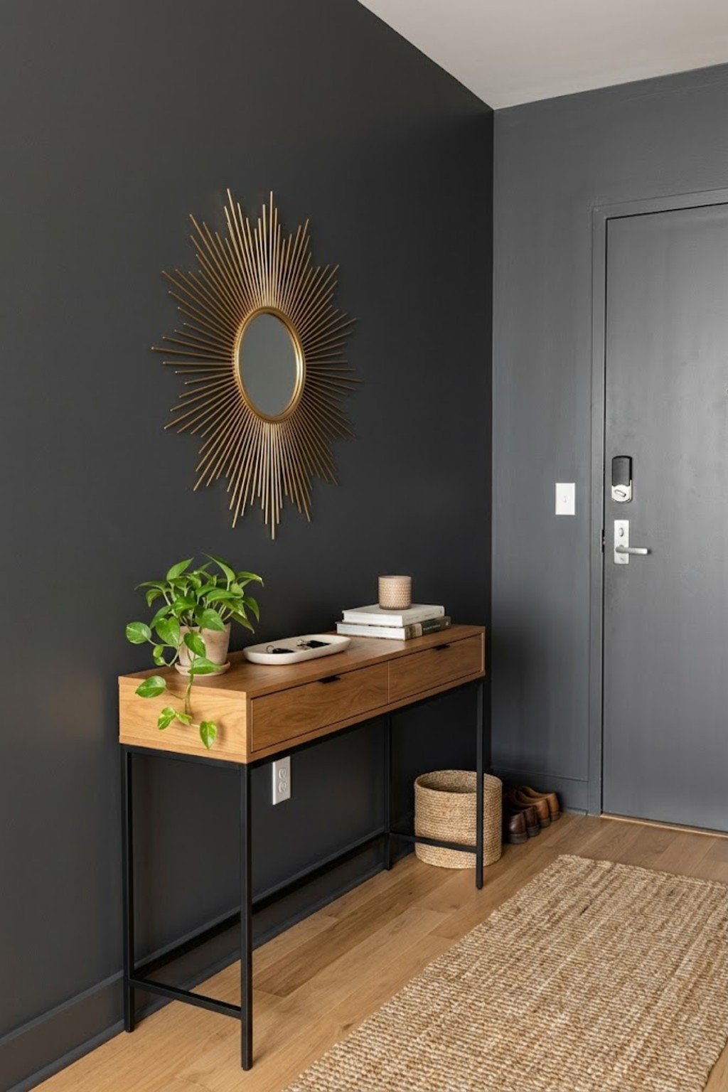 Hang a sunburst mirror in a small apartment entryway