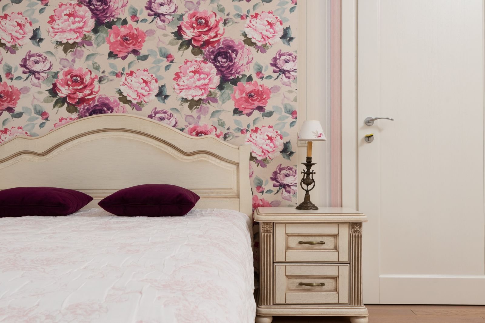 Floral wallpaper and classic styling in a rental bedroom