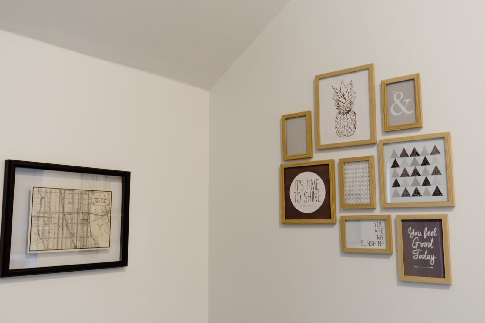 Organic cluster of mixed thrifted frames on a light wall