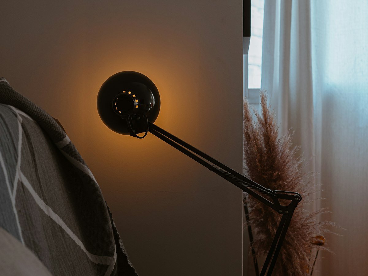 Cozy apartment corner with warm lamp lighting