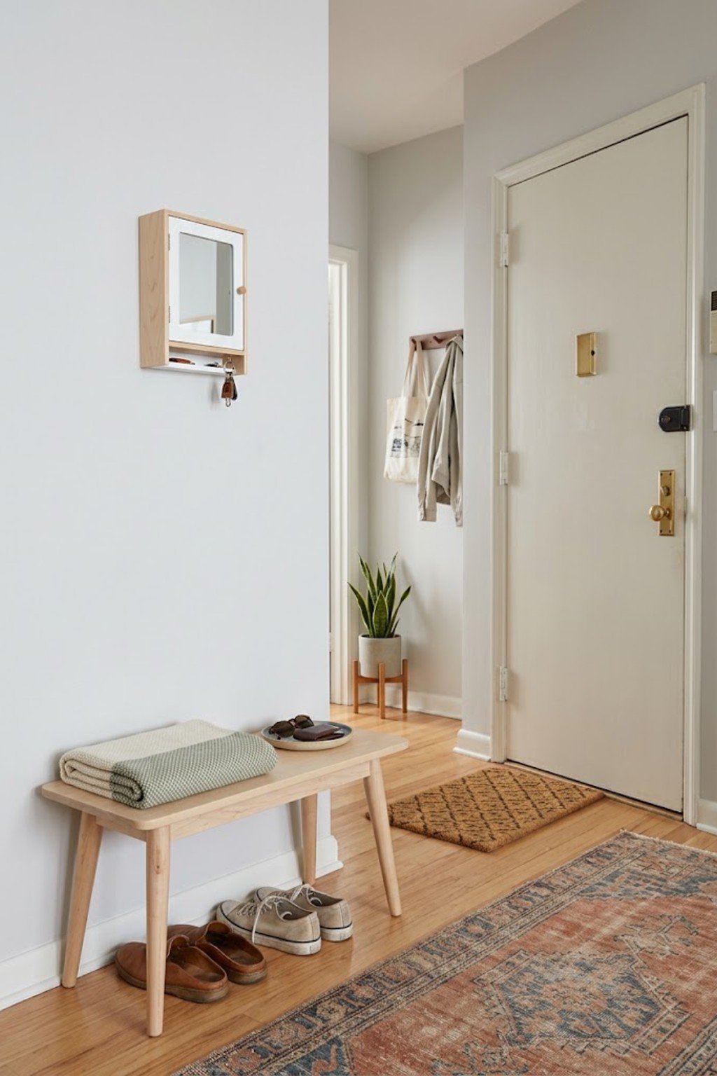 Use a wall-mounted key box in a small apartment entryway