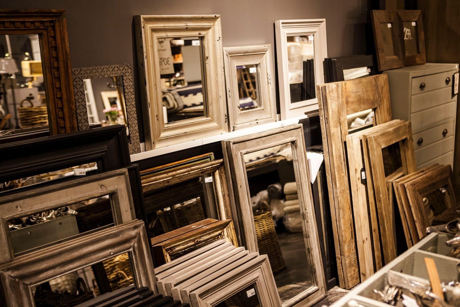 Stacks of secondhand picture frames at a thrift shop