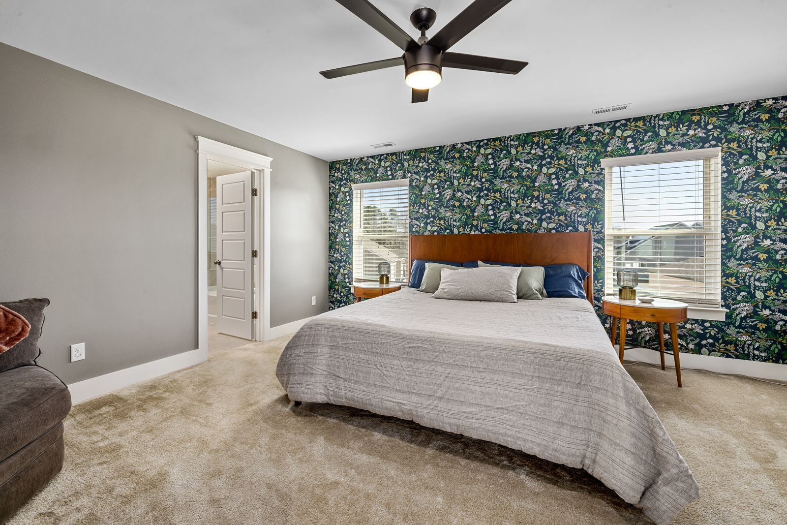 Botanical wallpaper on a single accent wall behind the bed